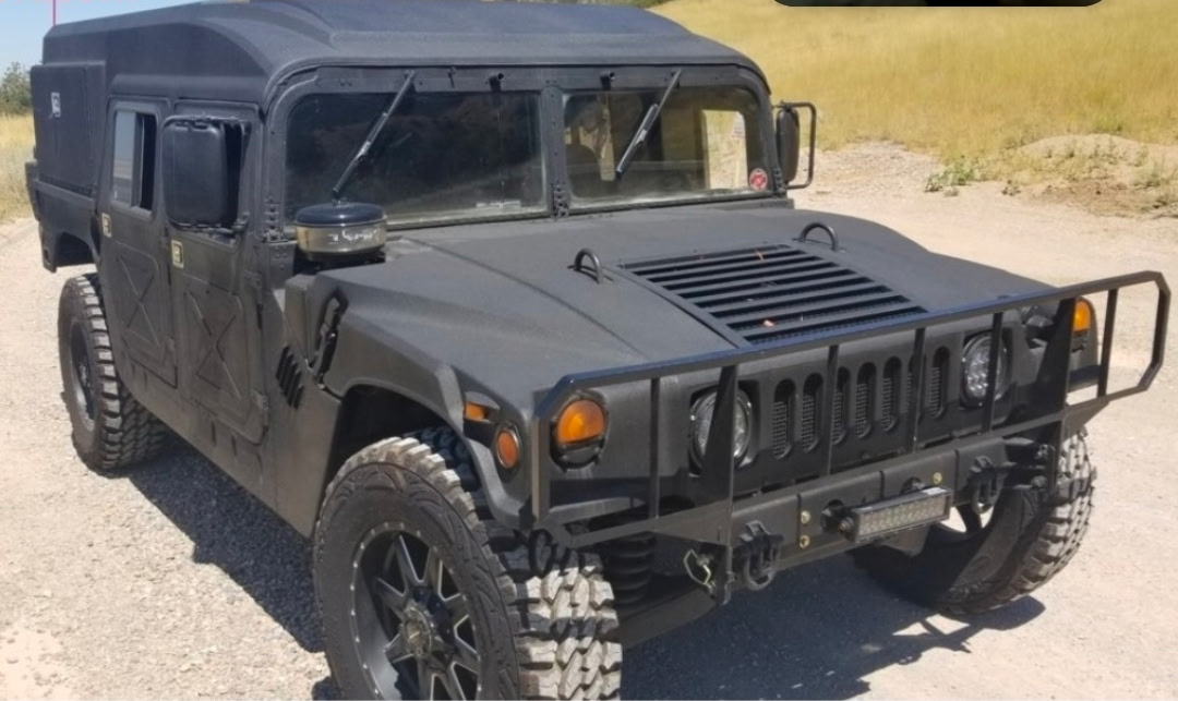 Blacked-out Humvee on new rubber